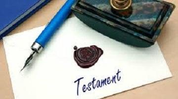 Stylo à bille, feuille de papier portant l'inscription "Testament